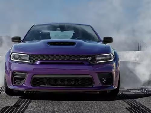 2023 Dodge Charger front view of vehicle on a raceway burning out