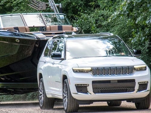 2024 Jeep Grand Cherokee towing a boat